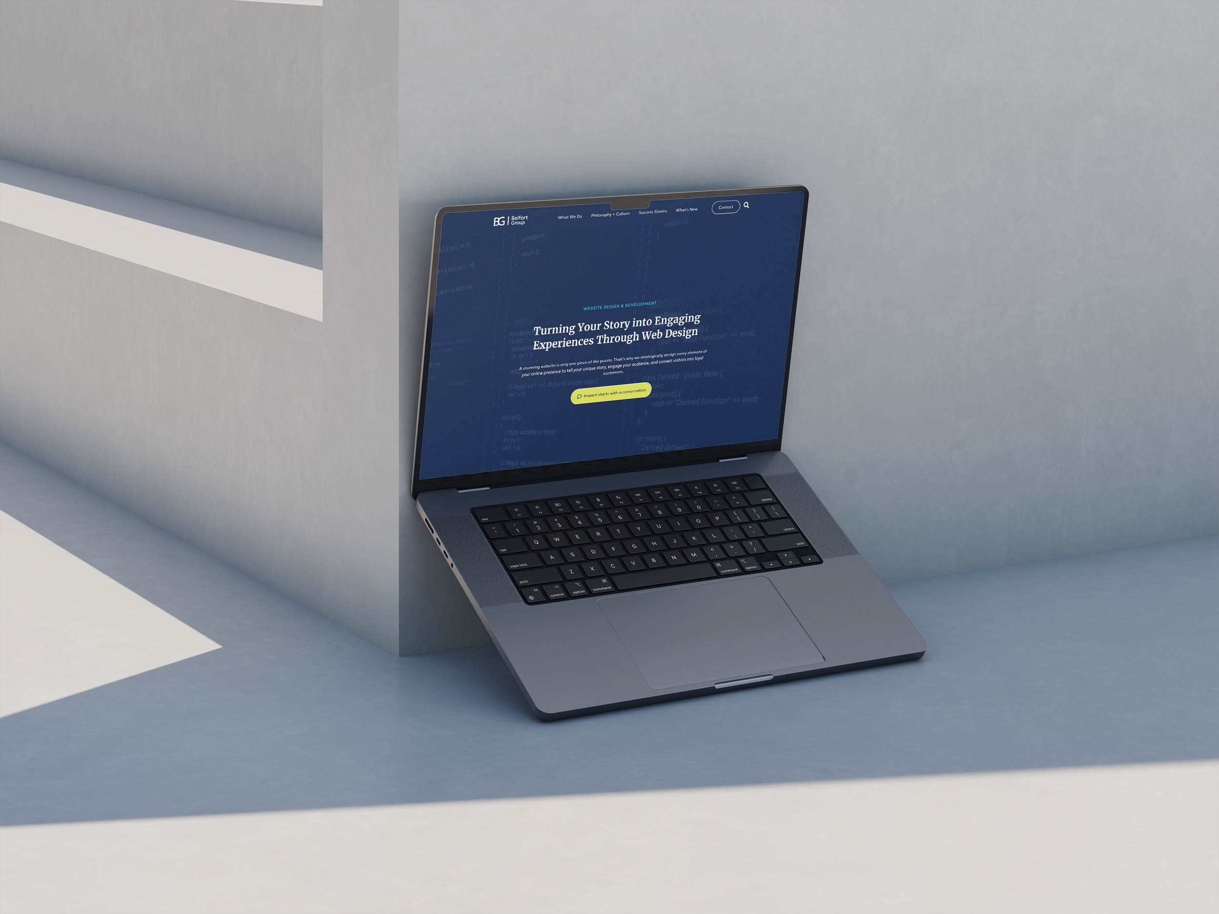 website displayed on laptop on solid concrete backdrop